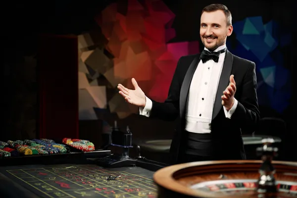 JLWILD Live Games — Take part in high-energy casino action A glowing roulette wheel with cascading chips, symbolizing the engaging live and instant-win games available on JLWILD.