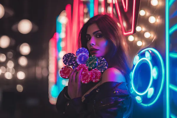 A woman in a luxurious green gown next to an ornate roulette wheel, capturing the upscale casino mood of JLWILD.