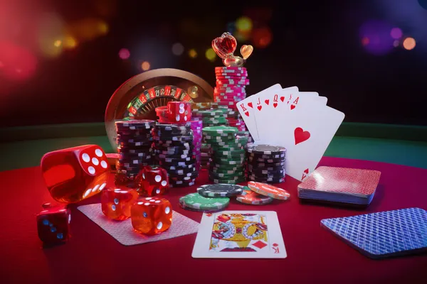A player using their smartphone during a festive local event, representing JLWILD’s fully mobile-friendly casino.
