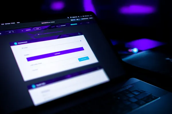 JLWILD Login — Instantly access your secure account A confident dealer surrounded by casino chips inviting players to access their JLWILD account, reflecting quick and easy login options.